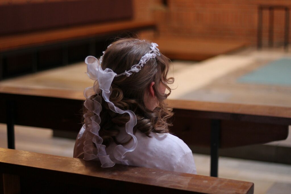 Girl dressed for her holy communion What’s happens in Spain and Cómpeta during the month of May?