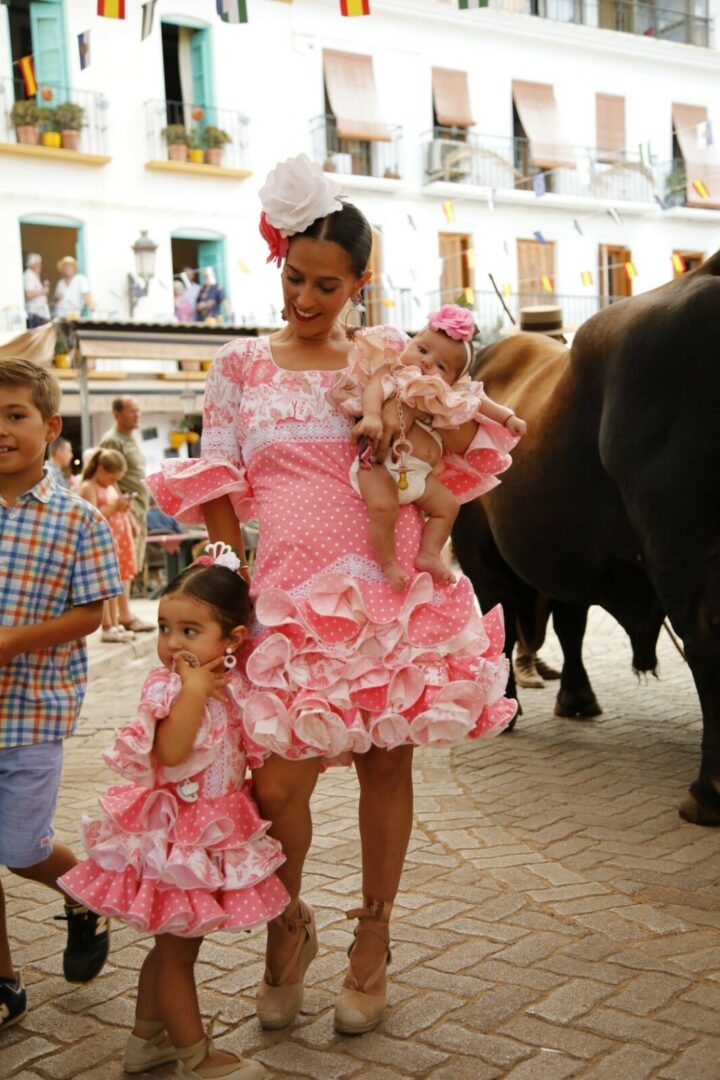 family dressed in traditional dress for the Competa Feria