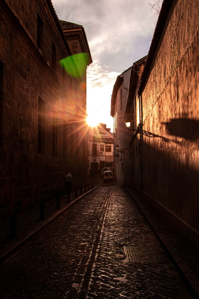 A view down a street in Granada at sunset