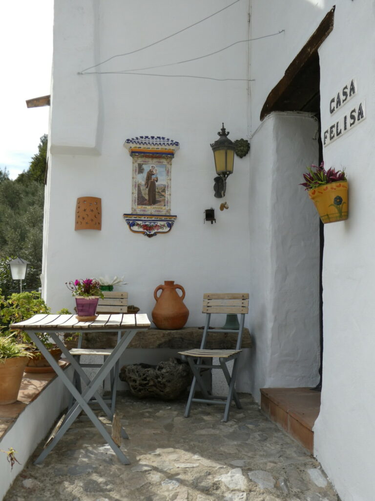 El Acebuchal - The lost Village. Pretty tables and chairs outside a house.